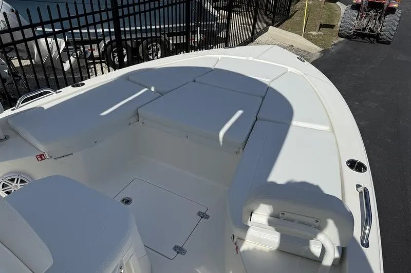 Slide: The Image of 2026 Pathfinder 2200 TRS boat interior with cushioned seating and storage compartments. - 6