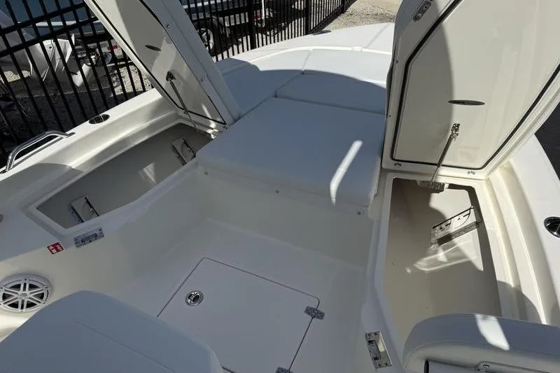 Slide: The Image of 2026 Pathfinder 2200 TRS boat interior with open storage compartments and seating. - 7
