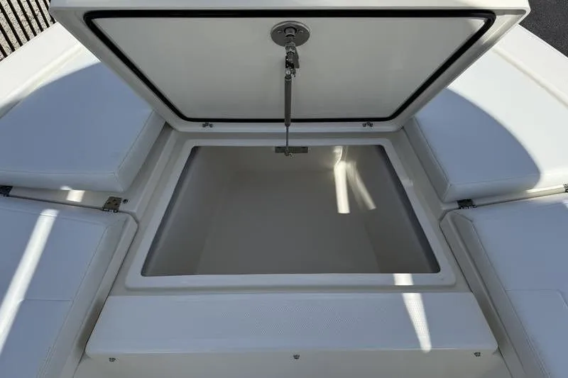 Slide: The Image of Open storage compartment on 2026 Pathfinder 2200 TRS boat, showcasing spacious interior. - 8
