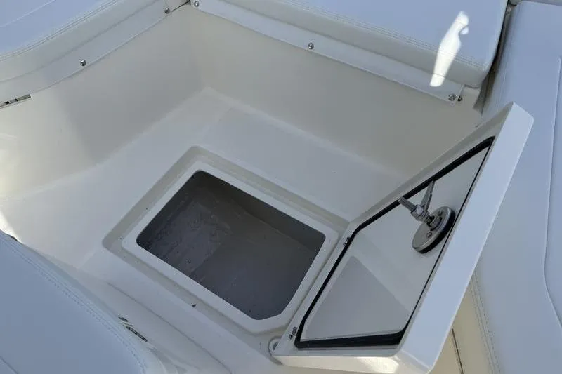 Slide: The Image of Open storage compartment on 2026 Pathfinder 2200 TRS boat. - 9