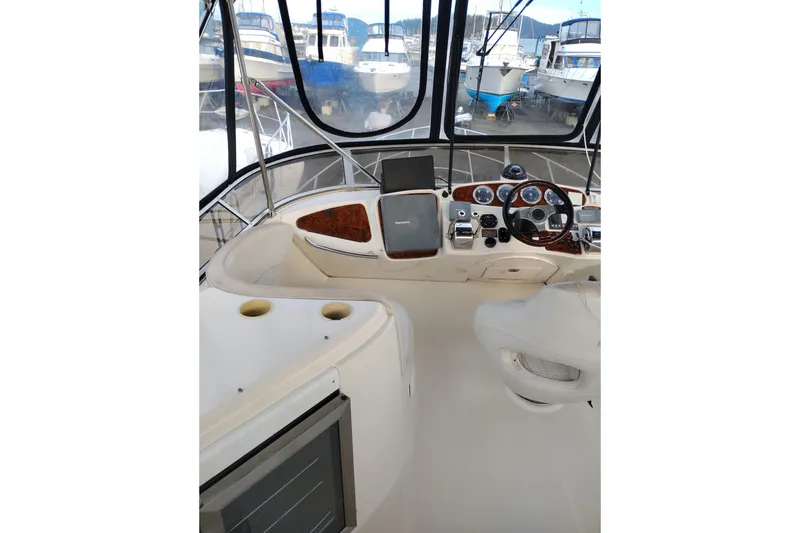 Slide: The Image of 2004 Meridian 459 Motoryacht helm with steering wheel and navigation equipment. - 11