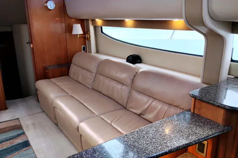 Slide: The Image of Luxurious interior of 2004 Meridian 459 Motoryacht with beige leather sofa and granite countertops. - 32