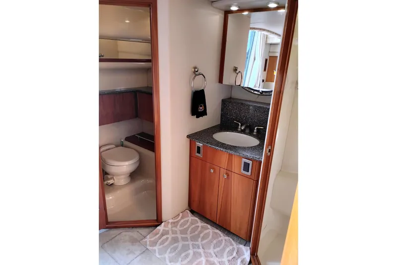 Slide: The Image of Bathroom interior of 2004 Meridian 459 Motoryacht with sink, mirror, and toilet. - 40