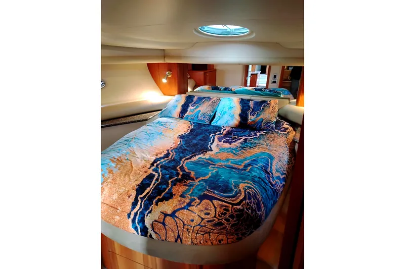 Slide: The Image of Luxurious bedroom in 2004 Meridian 459 Motoryacht with vibrant bedding and elegant lighting. - 56