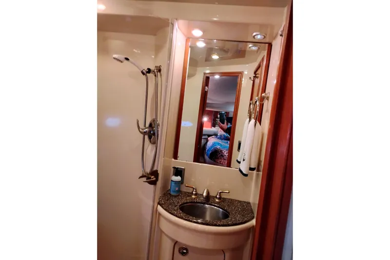 Slide: The Image of Bathroom interior of 2004 Meridian 459 Motoryacht with sink, mirror, and shower. - 59