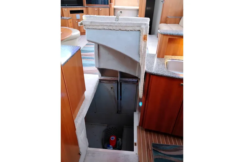 Slide: The Image of 2004 Meridian 459 Motoryacht interior with open engine compartment access. - 63