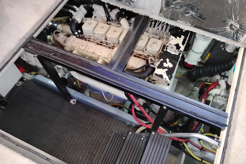 Slide: The Image of Engine compartment of a 2004 Meridian 459 Motoryacht, showing mechanical components and wiring. - 66