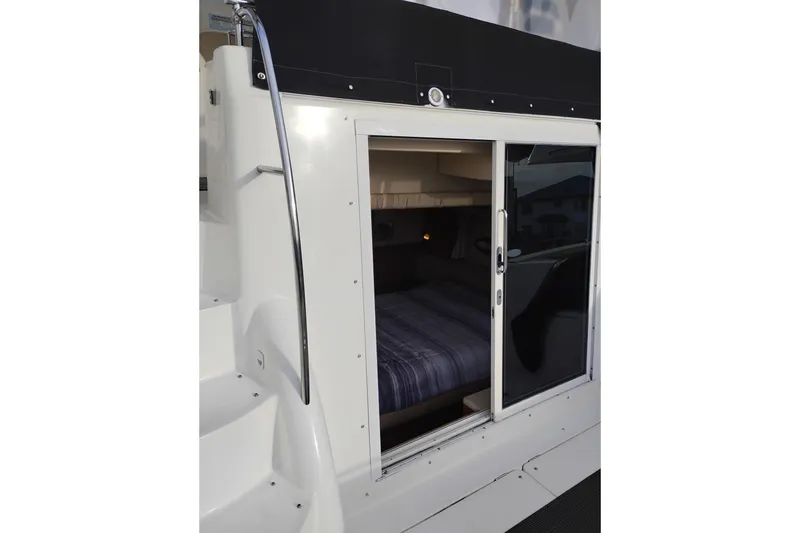 Slide: The Image of 2004 Meridian 459 Motoryacht cabin entrance with sliding glass door and visible interior. - 7