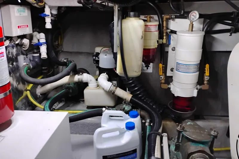 Slide: The Image of Engine room of 2004 Meridian 459 Motoryacht with fuel filters and hoses. - 70