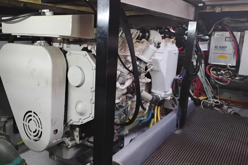 Slide: The Image of Engine room of 2004 Meridian 459 Motoryacht with visible machinery and wiring. - 71