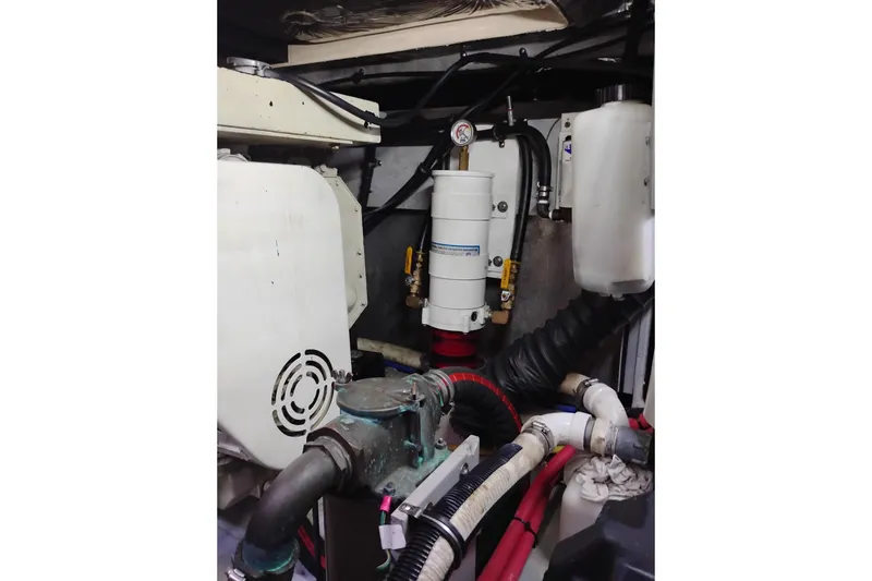 Slide: The Image of Engine room of 2004 Meridian 459 Motoryacht with visible mechanical components. - 72