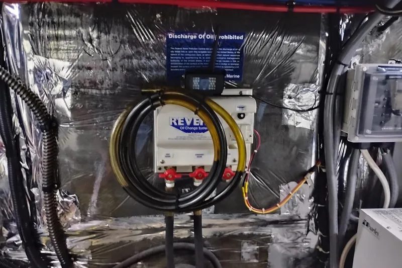 Slide: The Image of Engine room of 2004 Meridian 459 Motoryacht with oil change system and wiring. - 74