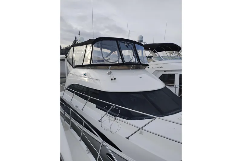 Slide: The Image of 2004 Meridian 459 Motoryacht with enclosed flybridge, docked in a marina. - 78