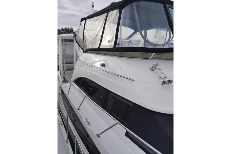 Slide: The Image of 2004 Meridian 459 Motoryacht with sleek design and enclosed upper deck. - 79