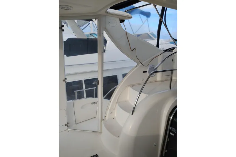 Slide: The Image of 2004 Meridian 459 Motoryacht interior with curved staircase and glass door. - 8