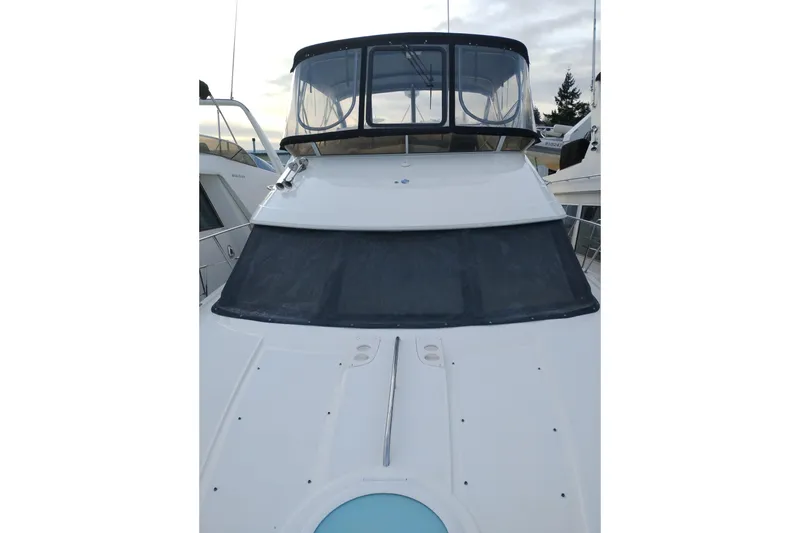 Slide: The Image of 2004 Meridian 459 Motoryacht, front view with enclosed flybridge and sleek design. - 81