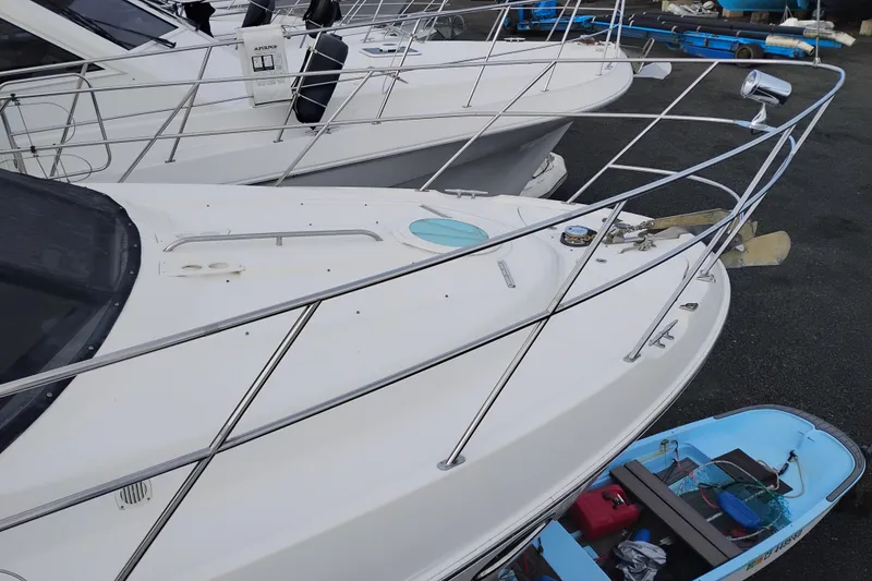 Slide: The Image of 2004 Meridian 459 Motoryacht docked, showcasing sleek design and spacious deck. - 83