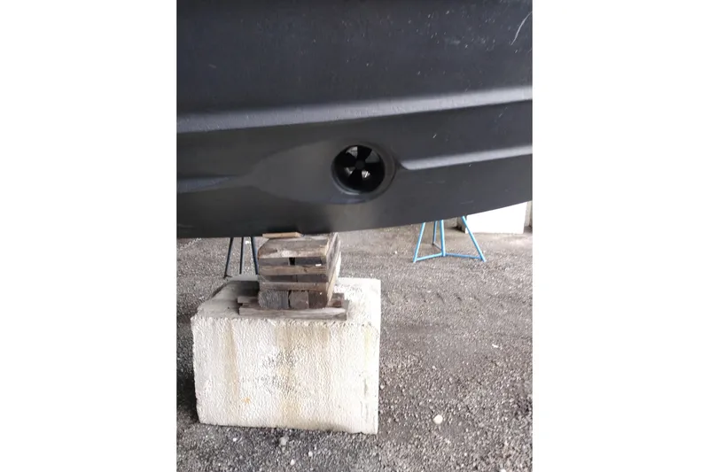 Slide: The Image of 2004 Meridian 459 Motoryacht hull on blocks, showcasing propeller detail. - 85