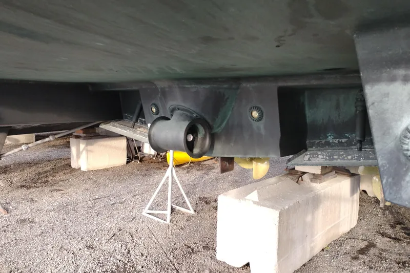 Slide: The Image of Bottom view of 2004 Meridian 459 Motoryacht on dry dock, showing hull and propeller shaft. - 86