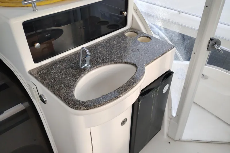 Slide: The Image of 2004 Meridian 459 Motoryacht interior with granite countertop and sink. - 9