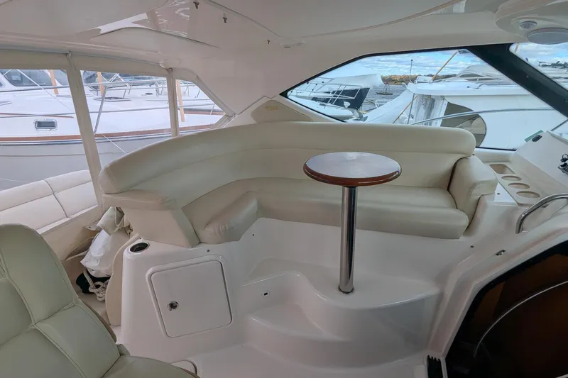 Slide: The Image of 2008 Tiara Yachts 3600 Sovran interior with cream leather seating and round table. - 10
