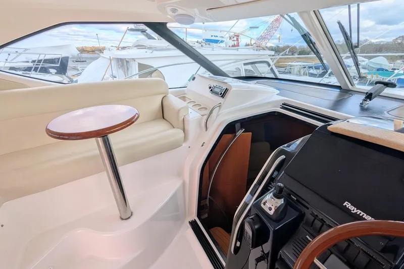 Slide: The Image of 2008 Tiara Yachts 3600 Sovran interior with helm, seating, and navigation equipment. - 12