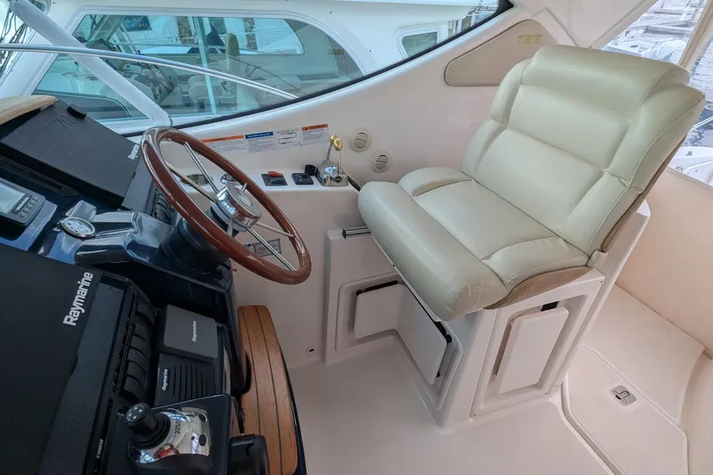 Slide: The Image of 2008 Tiara Yachts 3600 Sovran helm with leather captain's chair and Raymarine controls. - 13