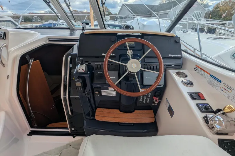 Slide: The Image of Helm of 2008 Tiara Yachts 3600 Sovran with Raymarine navigation system and wooden steering wheel. - 14