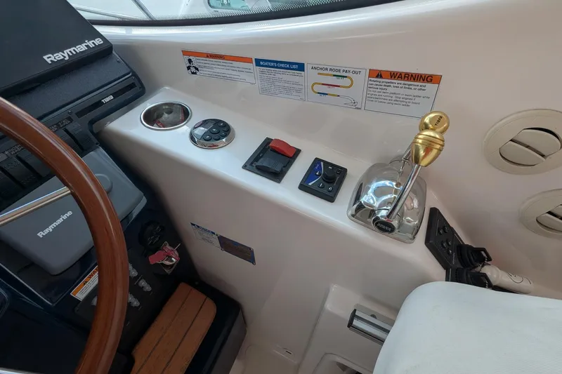 Slide: The Image of 2008 Tiara Yachts 3600 Sovran helm with Raymarine controls and throttle lever. - 17
