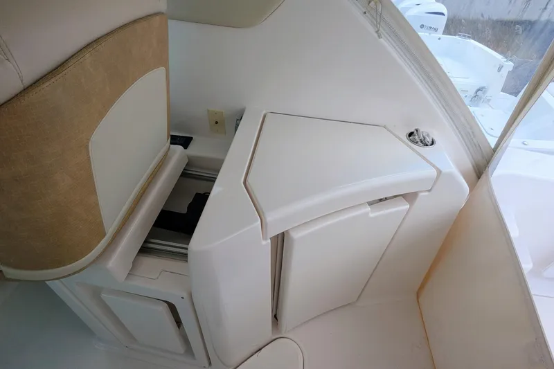 Slide: The Image of 2008 Tiara Yachts 3600 Sovran interior seating and storage area. - 18