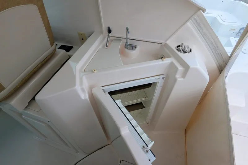 Slide: The Image of 2008 Tiara Yachts 3600 Sovran interior with sink and open storage compartment. - 19