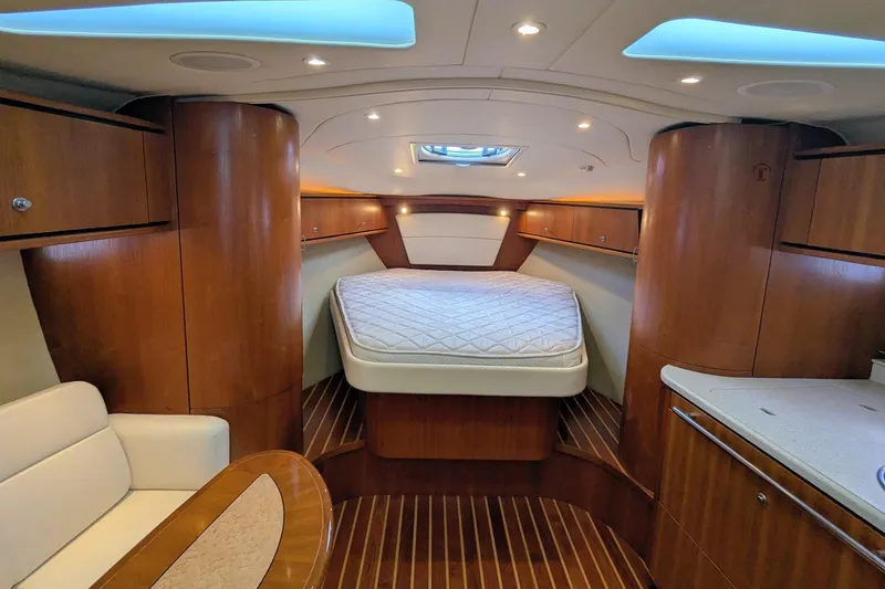 Slide: The Image of Luxurious 2008 Tiara Yachts 3600 Sovran cabin interior with wood finish and cozy bed. - 23