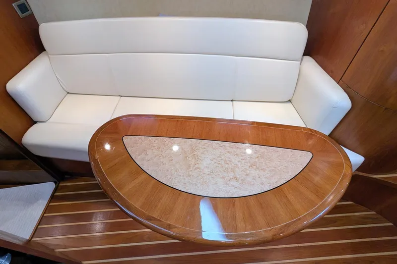 Slide: The Image of Luxurious interior of 2008 Tiara Yachts 3600 Sovran with elegant seating and wooden table. - 26