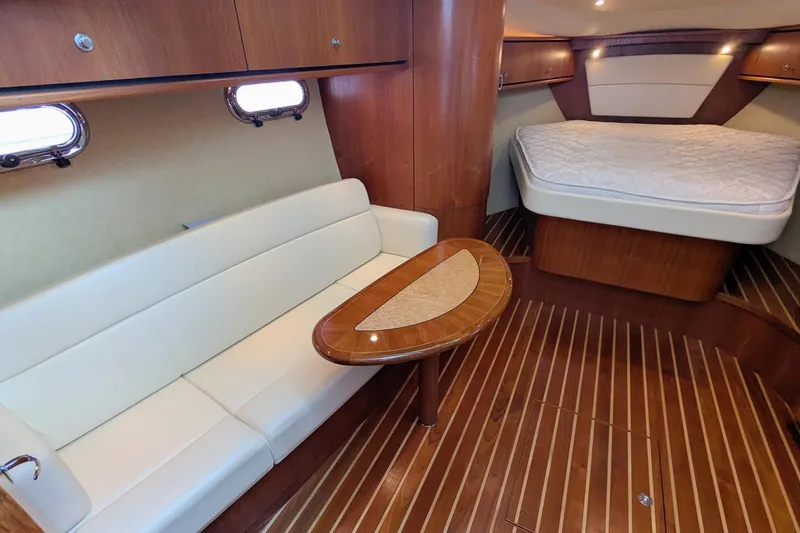 Slide: The Image of 2008 Tiara Yachts 3600 Sovran interior with elegant wood finish and cozy seating. - 27