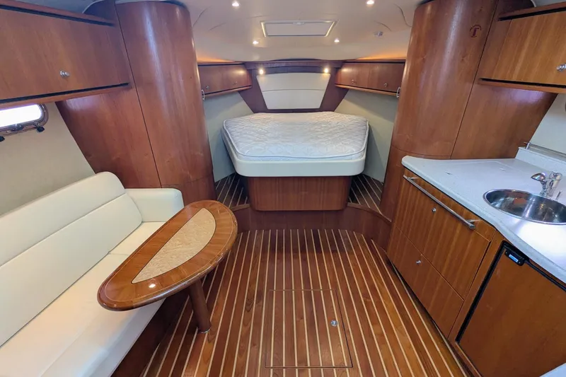 Slide: The Image of Luxurious interior of 2008 Tiara Yachts 3600 Sovran with wood finish and cozy seating. - 29