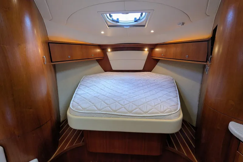 Slide: The Image of Luxurious cabin interior of 2008 Tiara Yachts 3600 Sovran with cozy bed and wooden finish. - 30