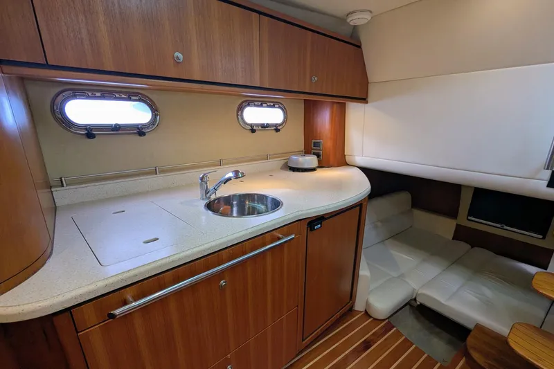 Slide: The Image of 2008 Tiara Yachts 3600 Sovran interior with kitchenette and seating area. - 36