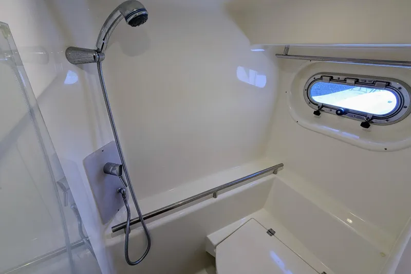 Slide: The Image of 2008 Tiara Yachts 3600 Sovran bathroom with shower and porthole window. - 42