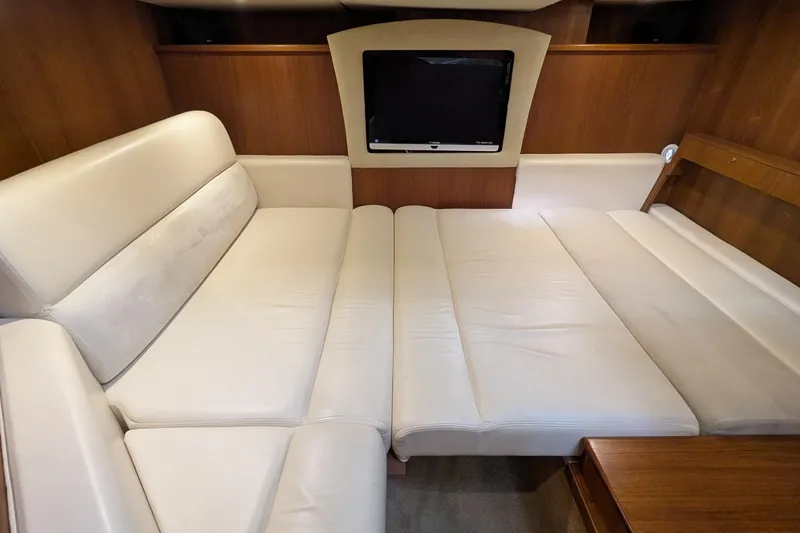 Slide: The Image of 2008 Tiara Yachts 3600 Sovran interior with beige leather seating and wall-mounted TV. - 43