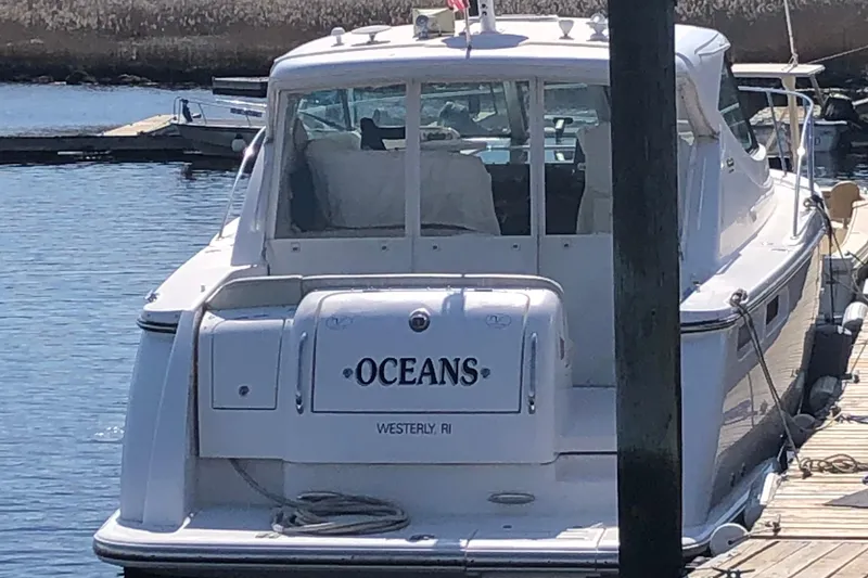 Slide: The Image of 2008 Tiara Yachts 3600 Sovran docked, rear view with "Oceans" name visible. - 6