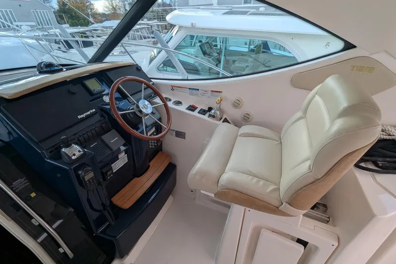 Slide: The Image of 2008 Tiara Yachts 3600 Sovran helm with leather captain's chair and Raymarine navigation. - 7