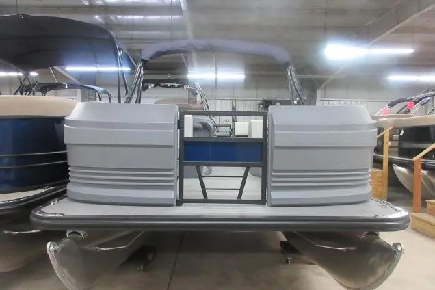 The Image of 2026 Sylvan A-16 pontoon boat in a showroom, featuring sleek design and modern amenities. - 2