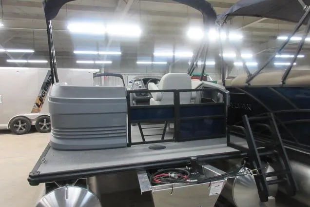 Slide: The Image of 2026 Sylvan A-16 boat interior with seating and control panel in showroom. - 4