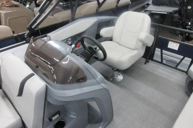 Slide: The Image of 2026 Sylvan A-16 boat interior with steering wheel and comfortable seating. - 6