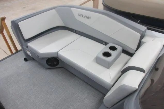 Slide: The Image of 2026 Sylvan A-16 boat seating with cup holders, featuring modern gray and white upholstery. - 9