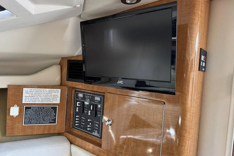 Slide: The Image of 2004 Regal 3060 Window Express interior with JVC TV and control panel. - 18
