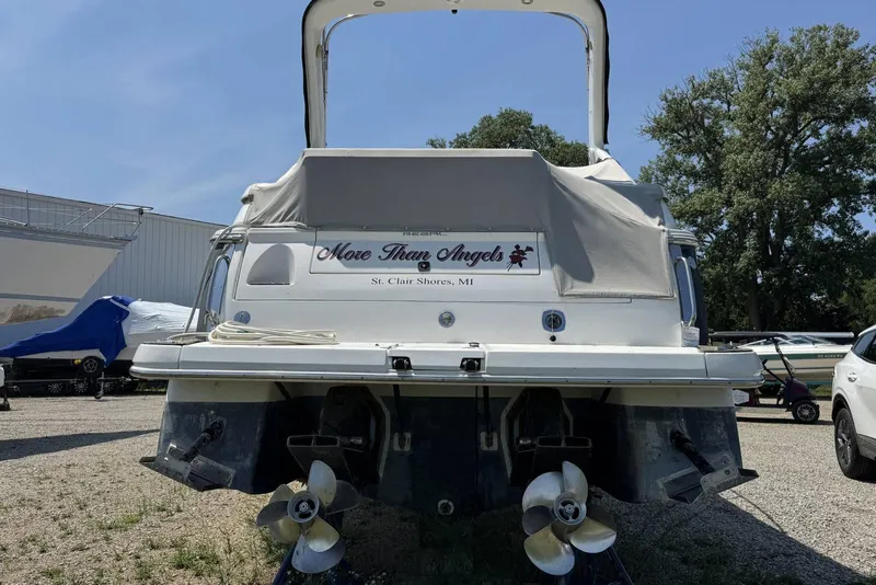 Slide: The Image of 2004 Regal 3060 Window Express boat, rear view, parked outdoors, St. Clair Shores, MI. - 3