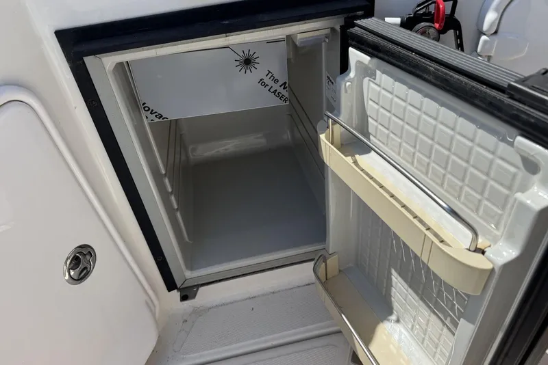 Slide: The Image of Open refrigerator on a 2004 Regal 3060 Window Express boat. - 7