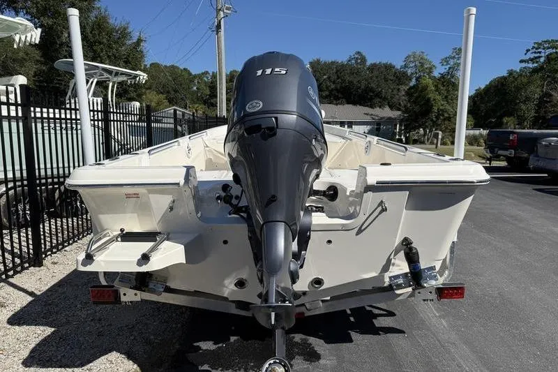 Slide: The Image of 2026 Bulls Bay 2000 boat with 115 HP outboard motor, parked outdoors. - 4
