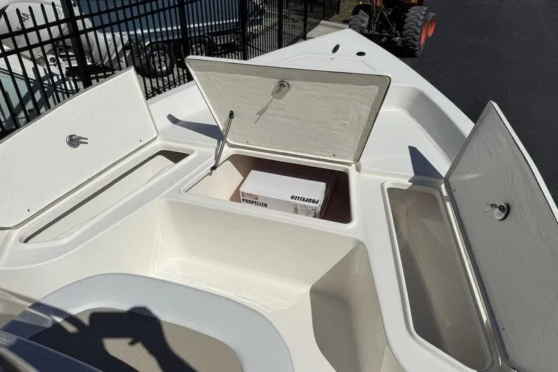 Slide: The Image of 2026 Bulls Bay 2000 boat storage compartments with propeller box, open hatches. - 6